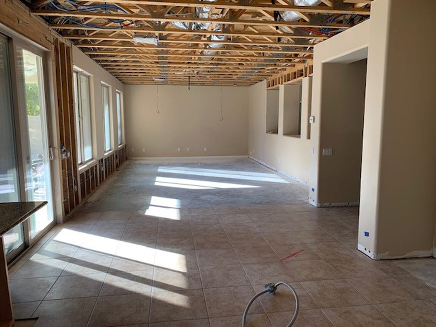 great room, Demo: Ceiling opened to the joists across the whole room.