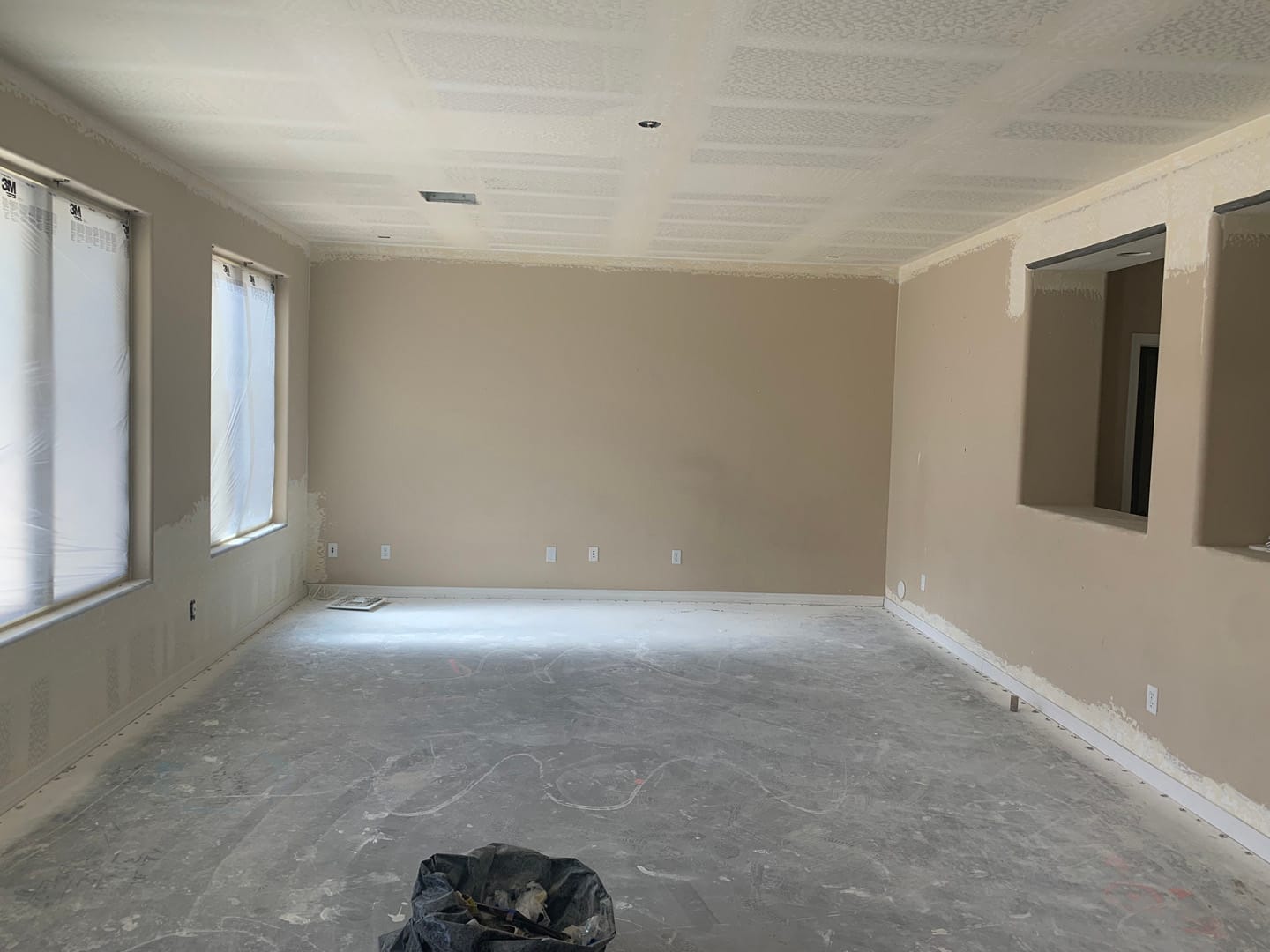 great room, Walls closed up: New drywall and texture, ready for flooring and finishes.